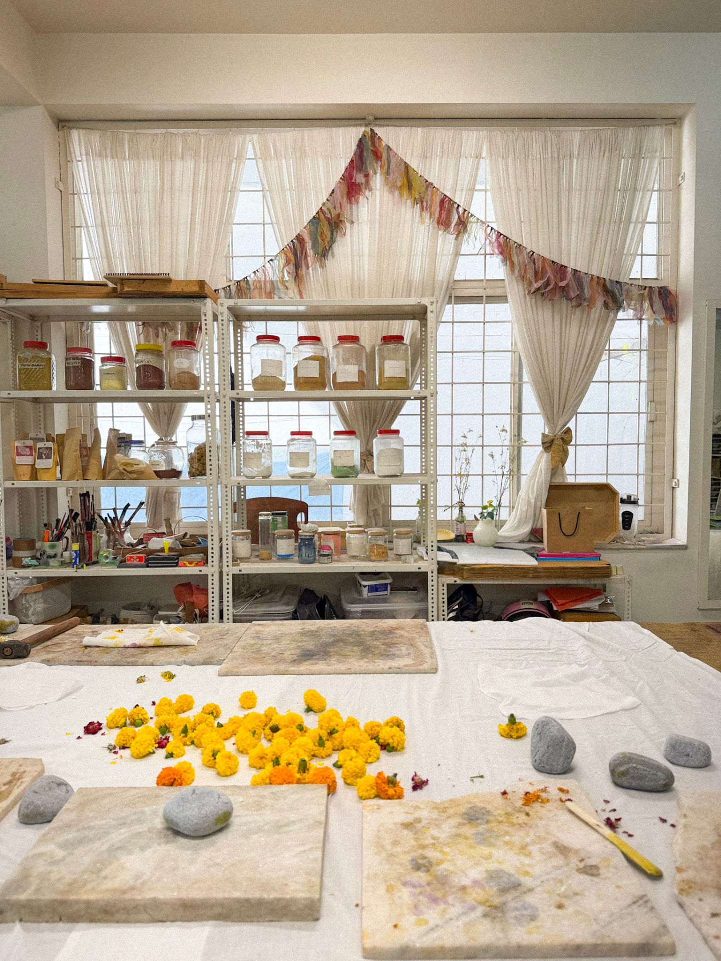 Marigolds and dye jars in the Heena Agrima studio