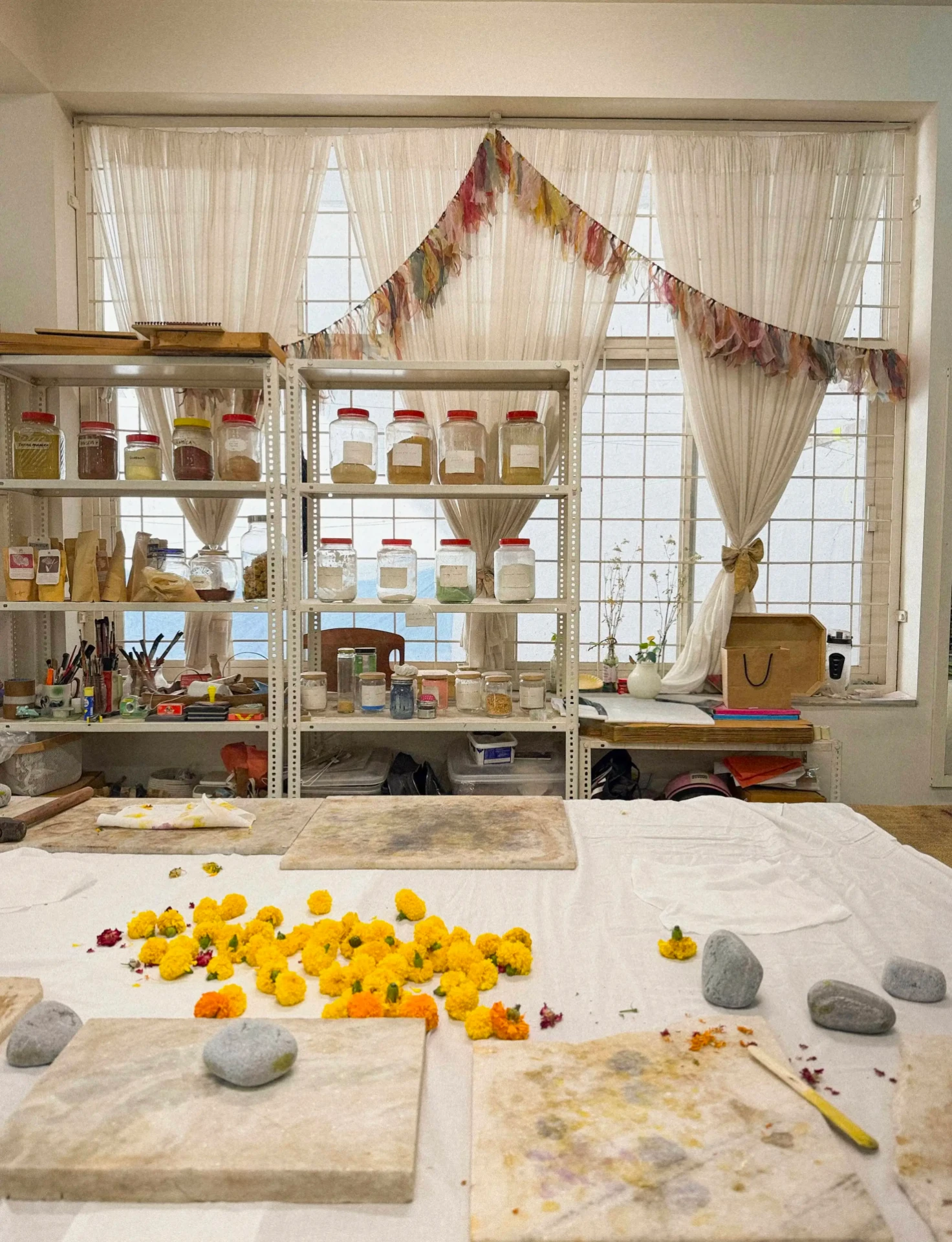 Marigolds and dye jars in the Heena Agrima studio