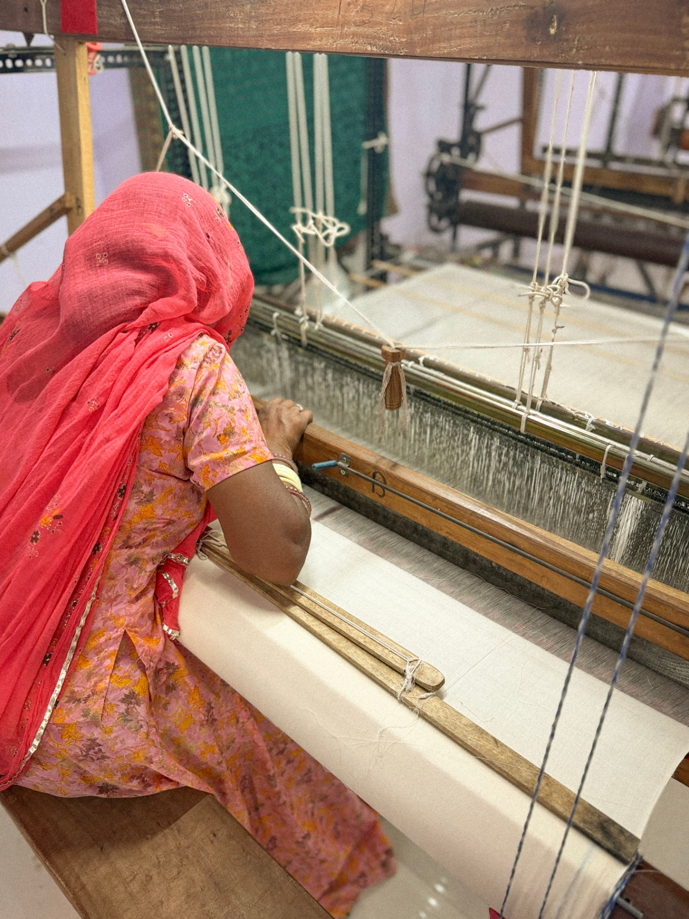 Handweaving silk on a traditional loom