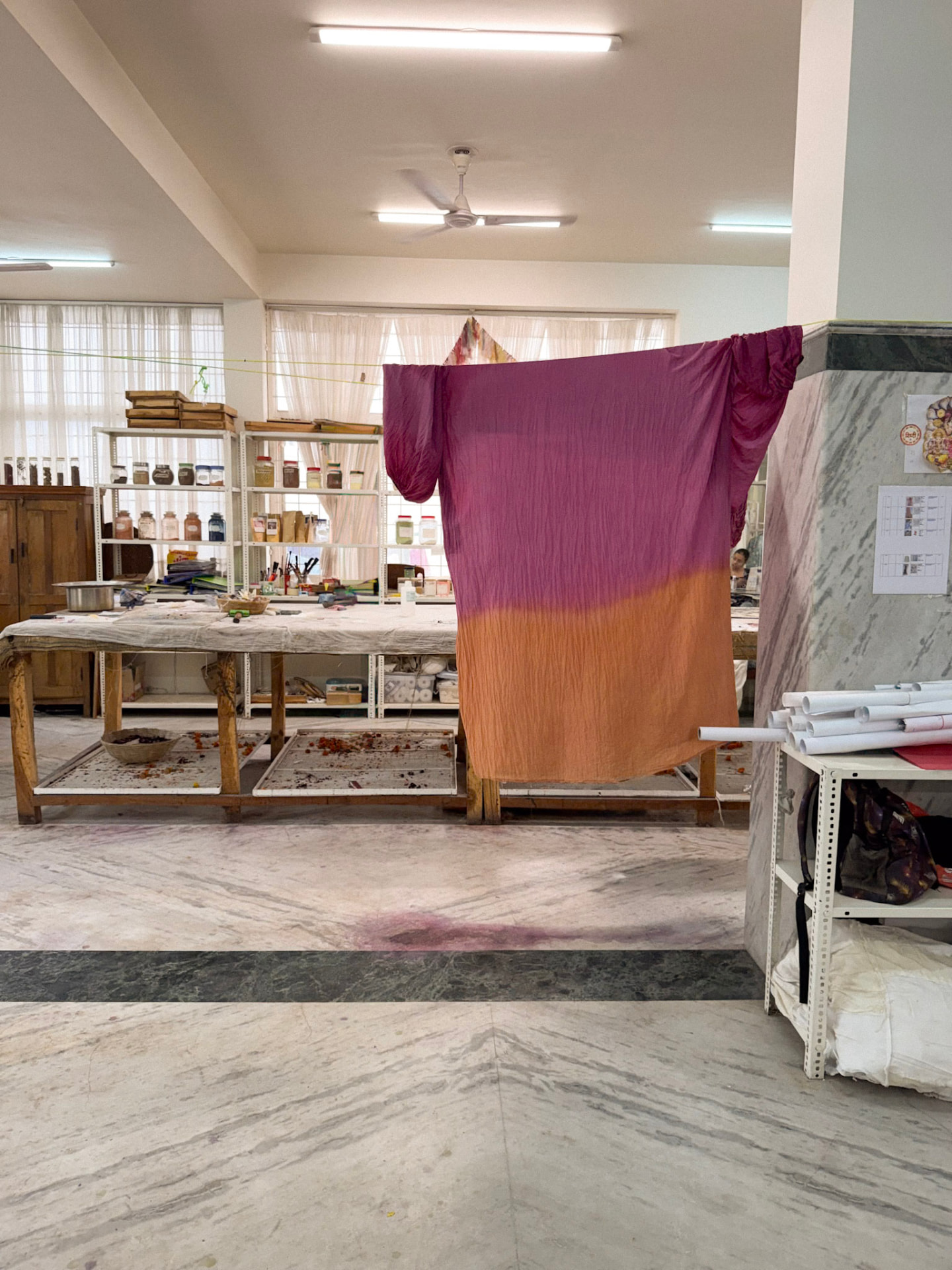 Plant-dyed ombré fabric drying in the studio